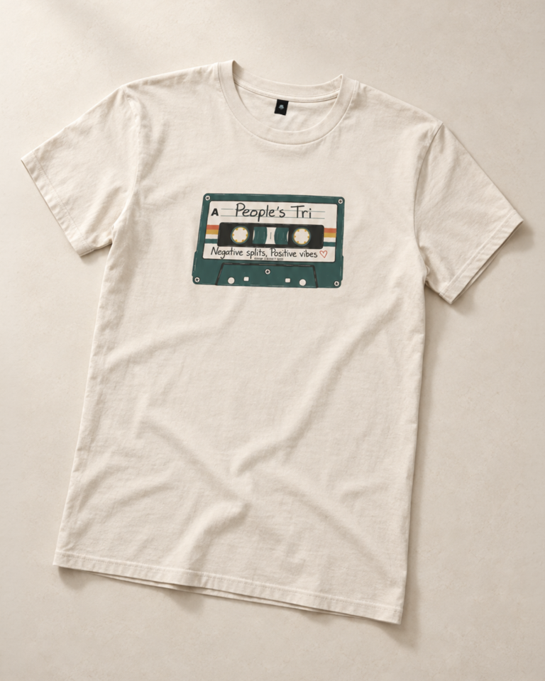 Cream People's Tri season tee with a retro cassette print and the words Negative splits, Positive vibes.