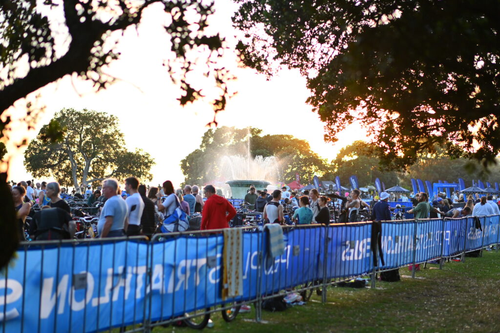 Peoples-Tri-race-morning-bikes-and-transition Athletes prepare among the bike racks beside the fountain at Mission Bay on race morning.